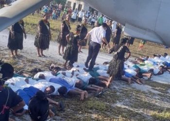 Photo of Chinese Ambassador Stepping on the Backs of Kiribati Residents Generating Controversy