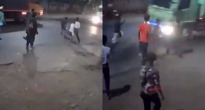 An Action by a Group of Teenagers to Stop a Truck, Run Over and Trigger a Collision in a Row