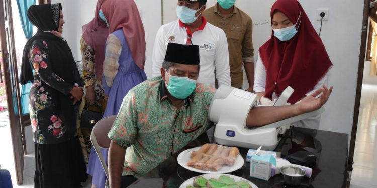 Siak Regency Government Distributes Phase II Basic Food Aid for 33 Thousand Households in Pusako