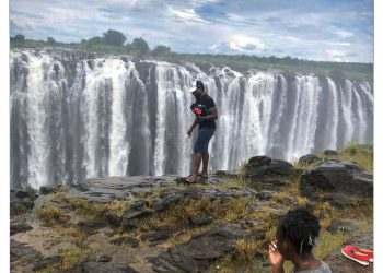 Photo of a Man Walking Along Edge of Victoria Falls Before Plummeting to His Death