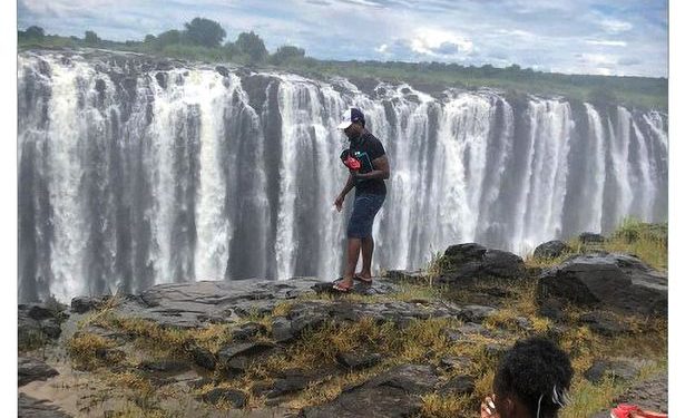 Photo of a Man Walking Along Edge of Victoria Falls Before Plummeting to His Death