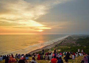 Enjoying a Romantic Sunset in Parangtritis Beach