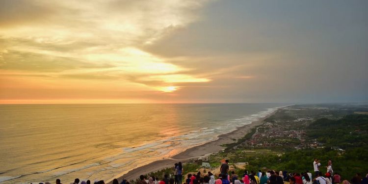 Enjoying a Romantic Sunset in Parangtritis Beach