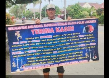 Ini Respon Polisi Perihal Pria Viral Bawa Banner Minta Oknum Polsek Bangil Ditindak